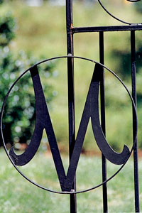 Metal gate with Meredith M outlined.