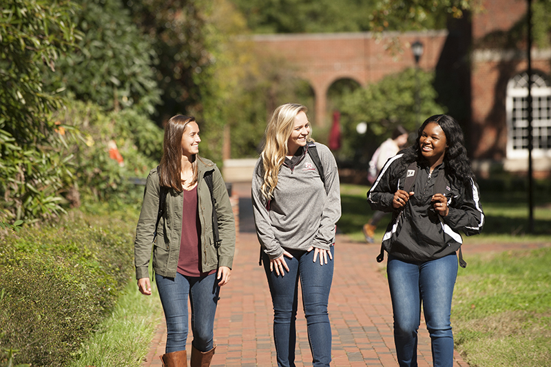 students walking on campus fall