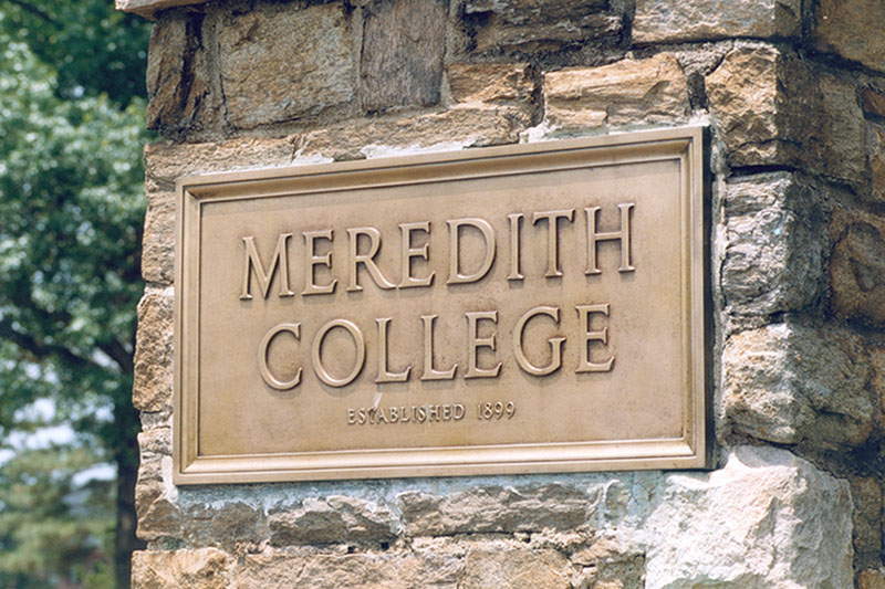 Meredith College Printed on Metal Sign hanging on front entrance stone pillar