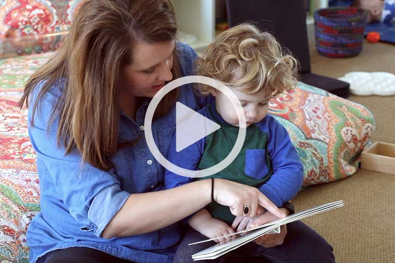 Click image of mother reading to child to watch a video in modal explaining The Power of Picture Books