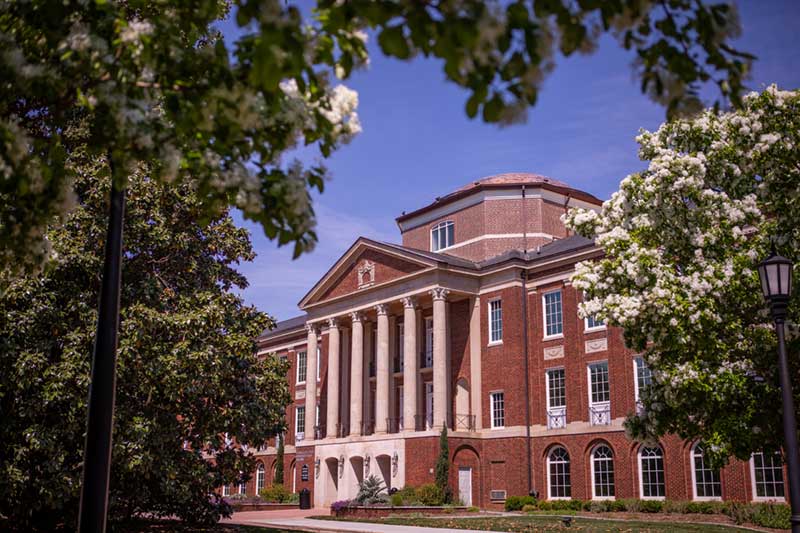 Front of Johnson Hall with magnolia trees.
