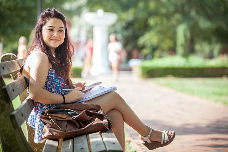 student sitting on bench