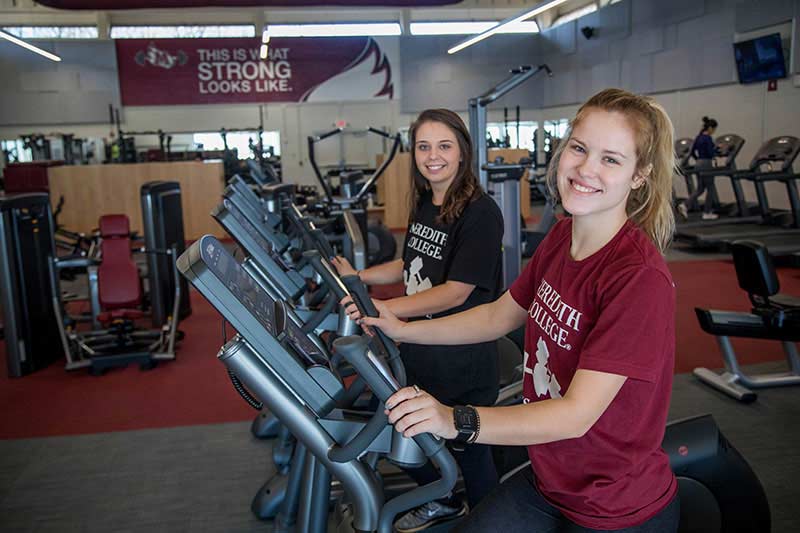Two Meredith students on treadmills in the fitness center