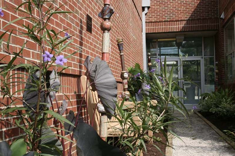 Sculptures and plants outside of Frankie G. Weems art gallery.