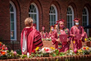 President Allen presenting a degree to WINGS student Barbara Daniel