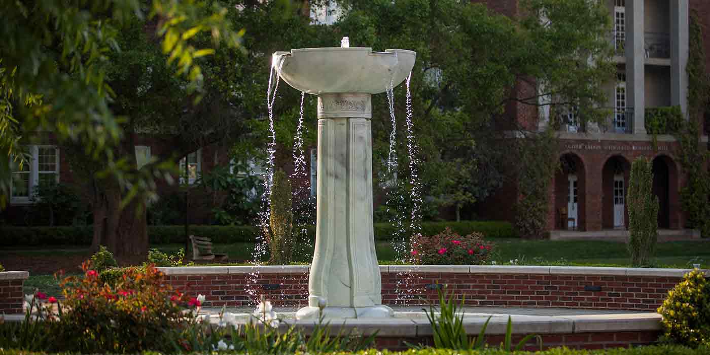 The Meredith fountain with sunlight shining on it.