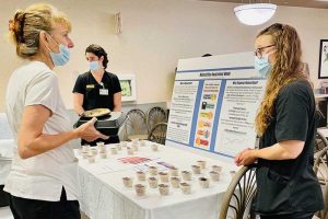 Students discuss their presentation for Malnutrition awareness week