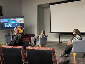 People pay attention to a zoom screen during the 2023 Documentary Film Festival.