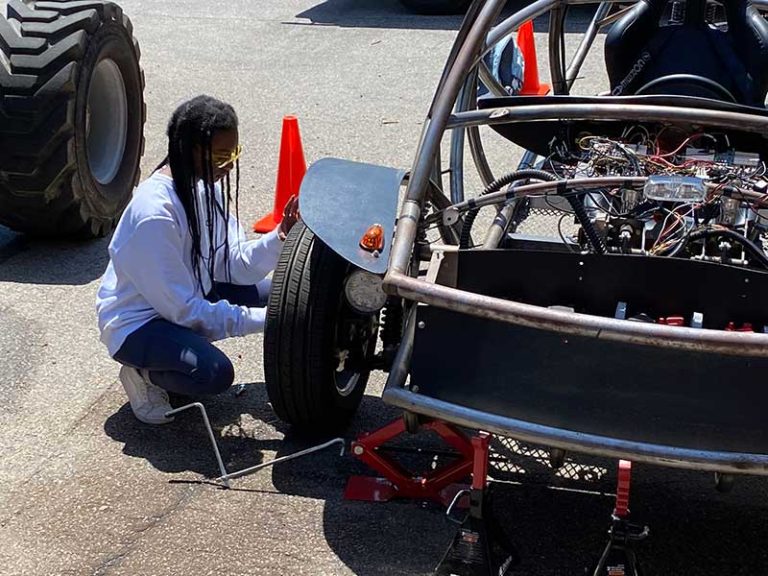 Students working on EV Car