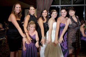 Seven alumnae show off their rings at a wedding of an alum.