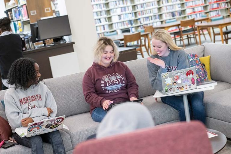 Three Students Studying on Library couch