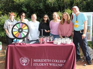 Six students stand with provost Matthew Poslusny at the donate plasma event.