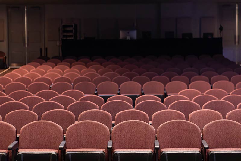 Jones Auditorium interior with new mauve seating.