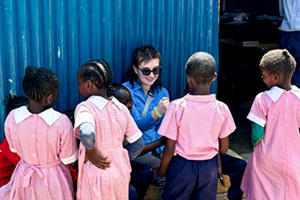 Meredith student with Kenyan elementary students