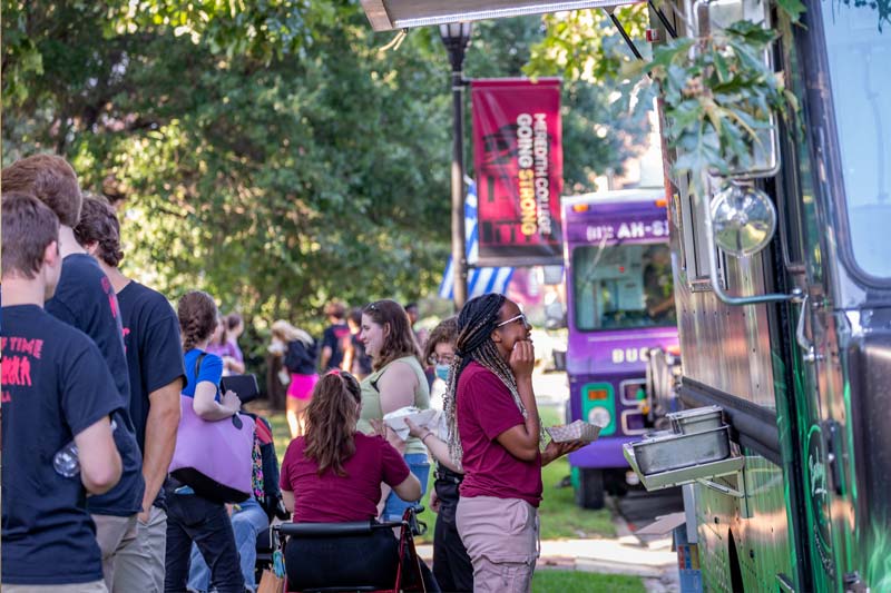 Students Buying food from Food truck Vendors.